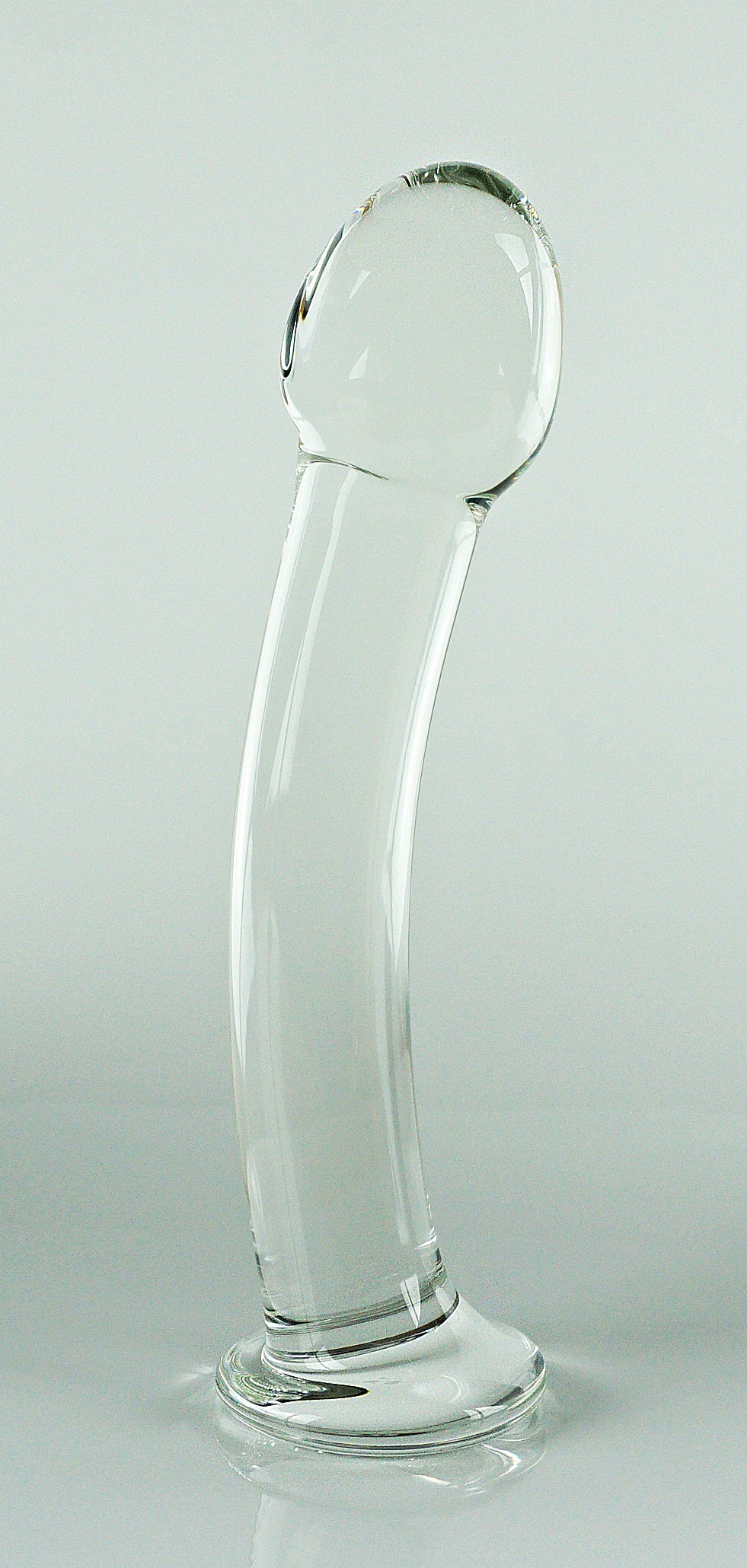 Pequeño consolador de cristal con cabeza esculpida